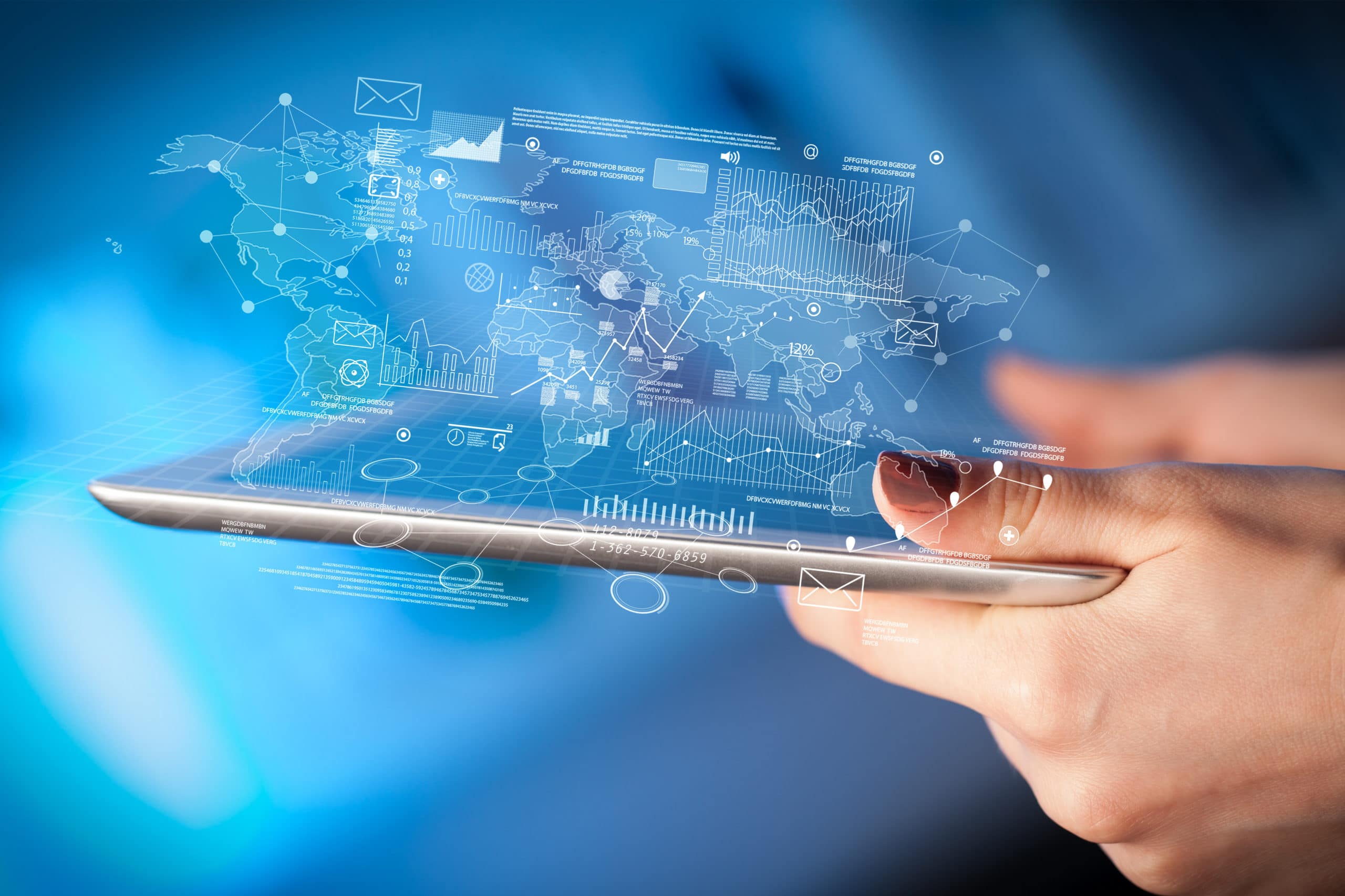 Fingers touching tablet with charts