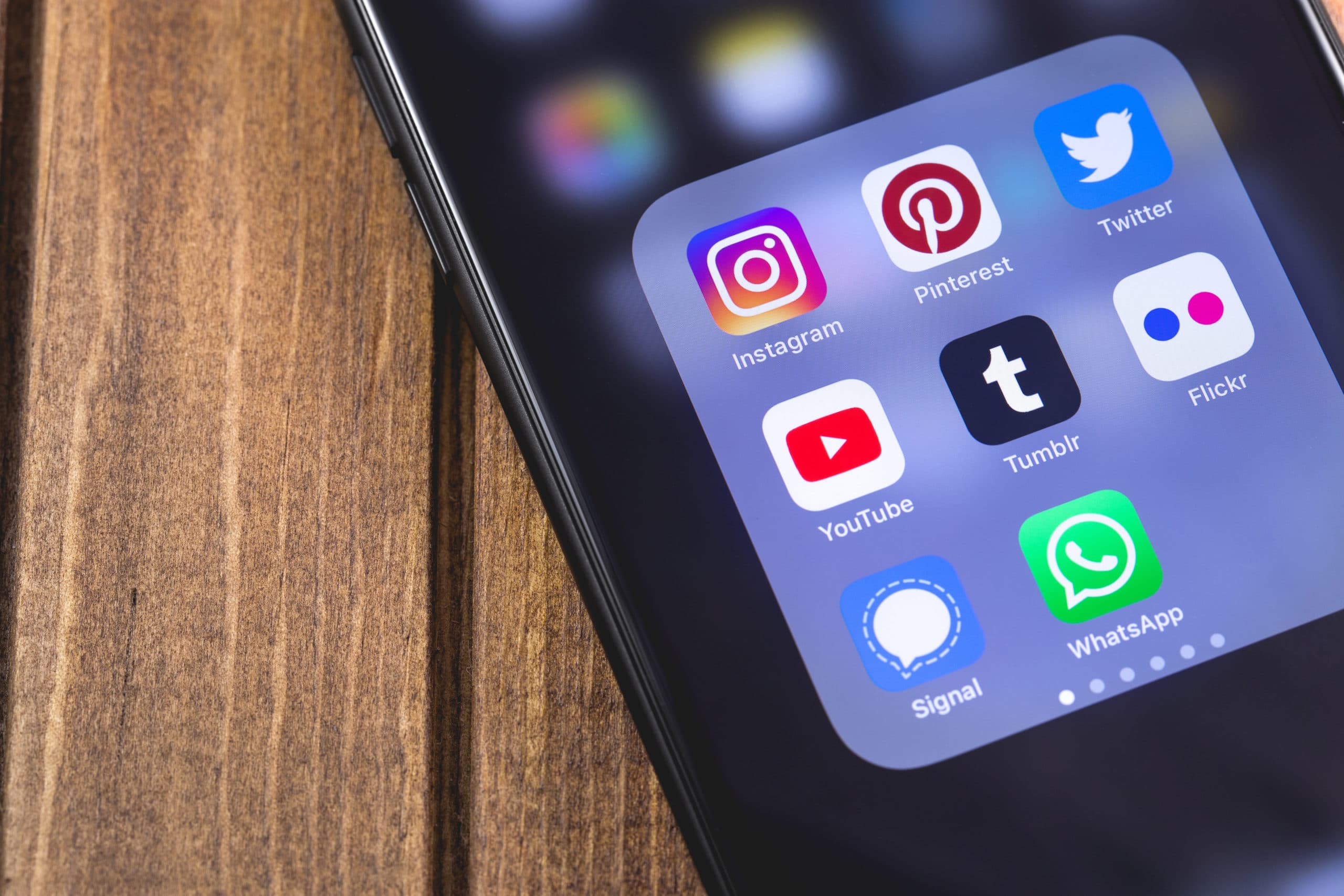 smartphone with social media apps (YouTube, Instagram, Flickr, T
