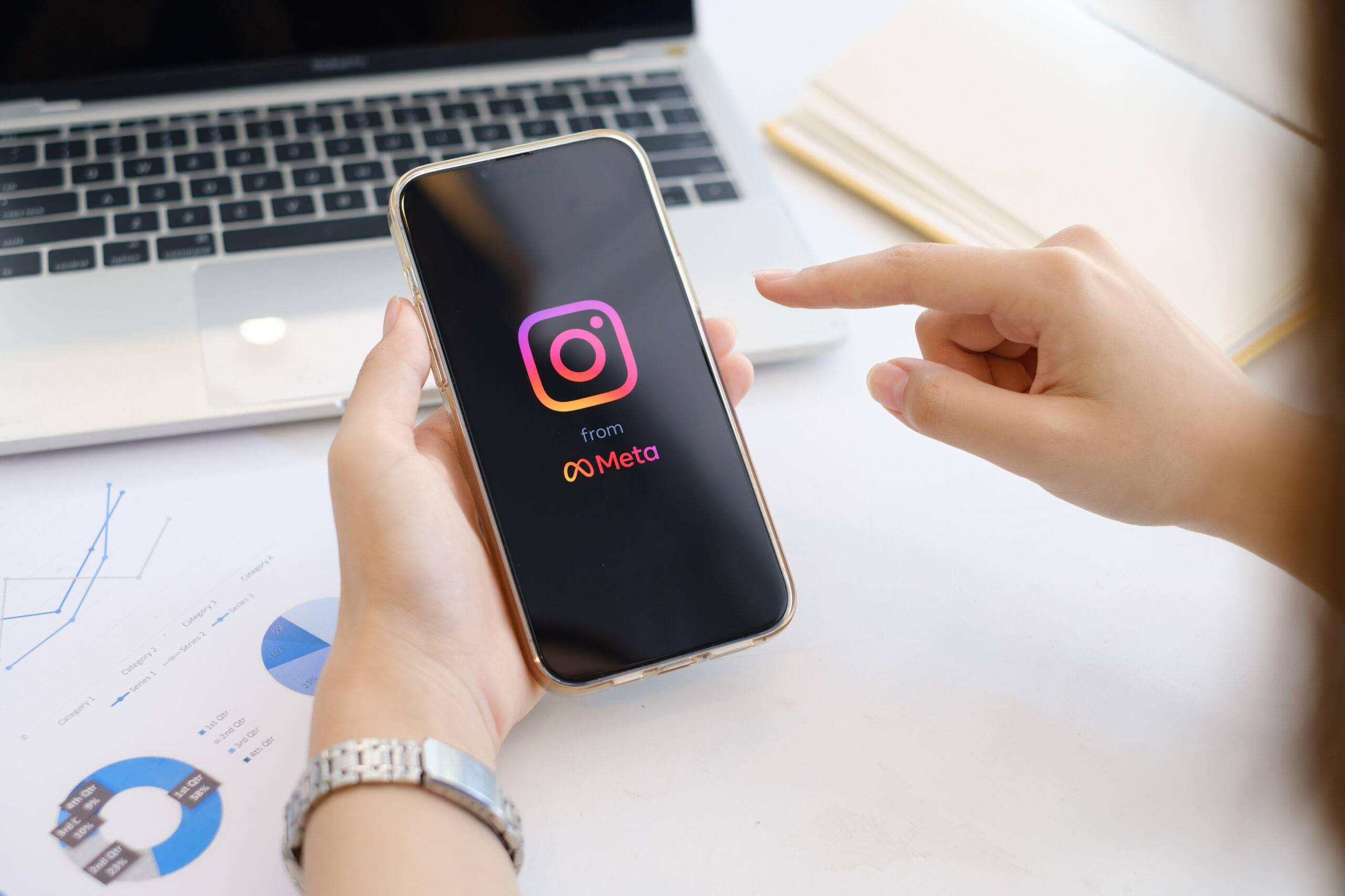A Woman using Instagram application on iPhone. Instagram reels for making short videos from Meta