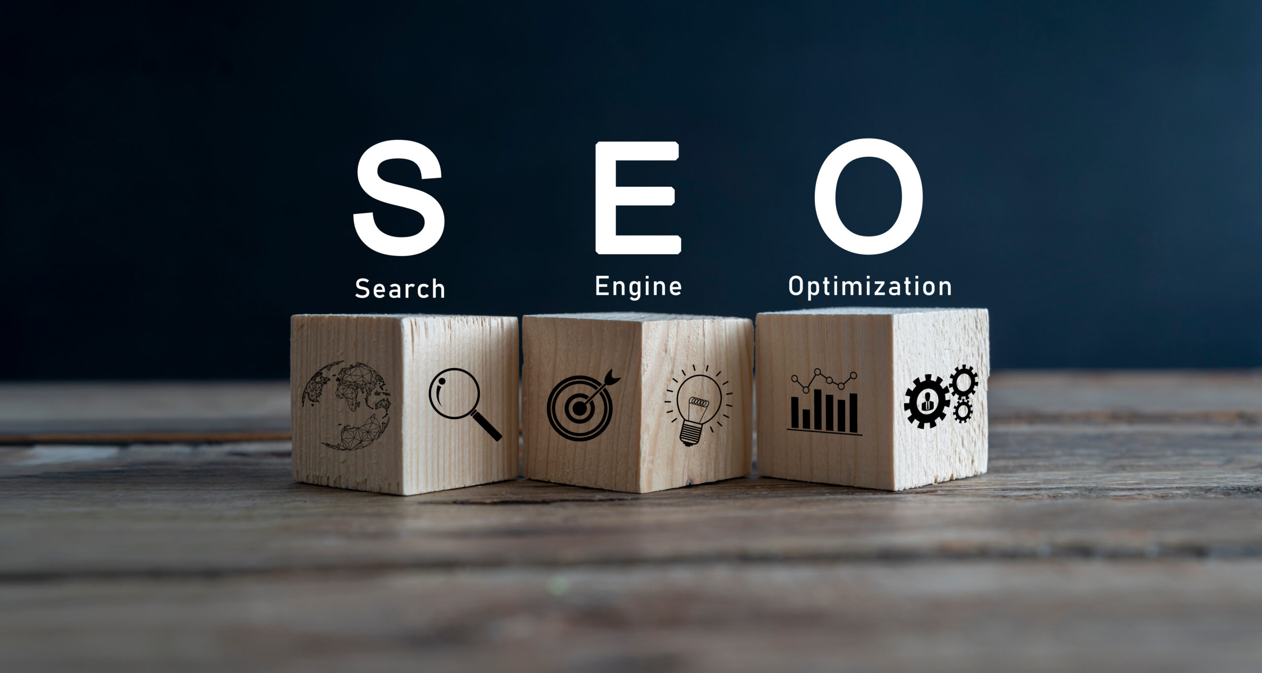 SEO text wooden cube blocks on table background. Idea, Vision.